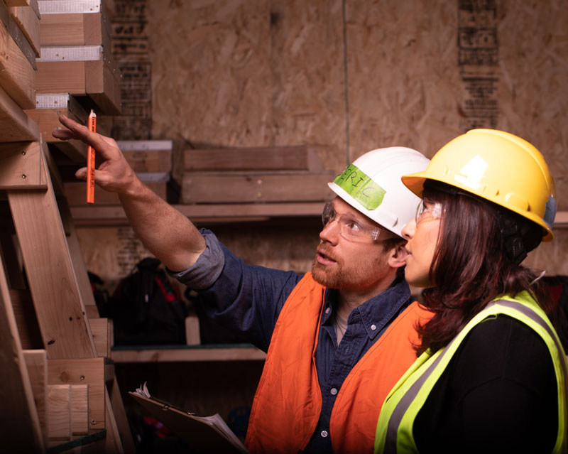 student and instructor at a construction academy