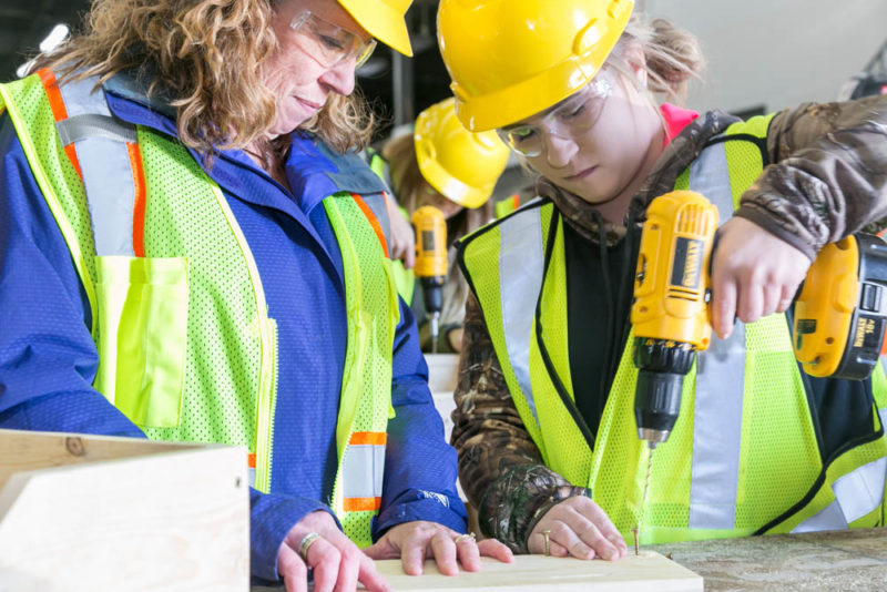 Woman learning drilling techniques